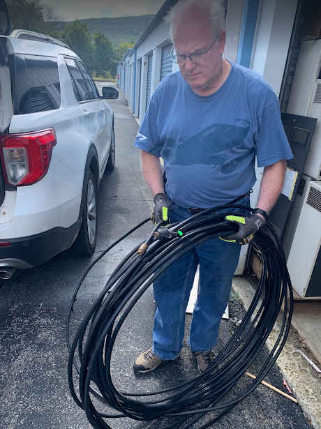 Steve Smith, KM4CJ, sorting hardline for upcoming project